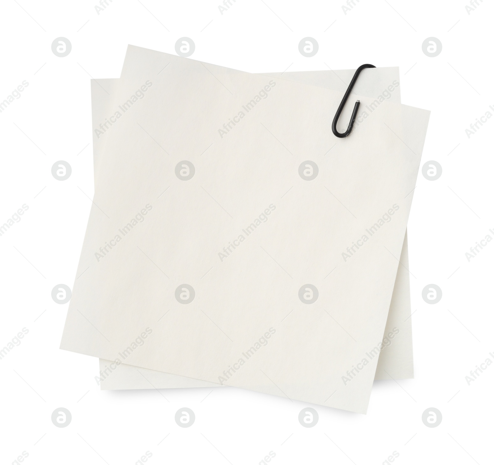 Photo of Blank paper note attached with clip isolated on white, top view