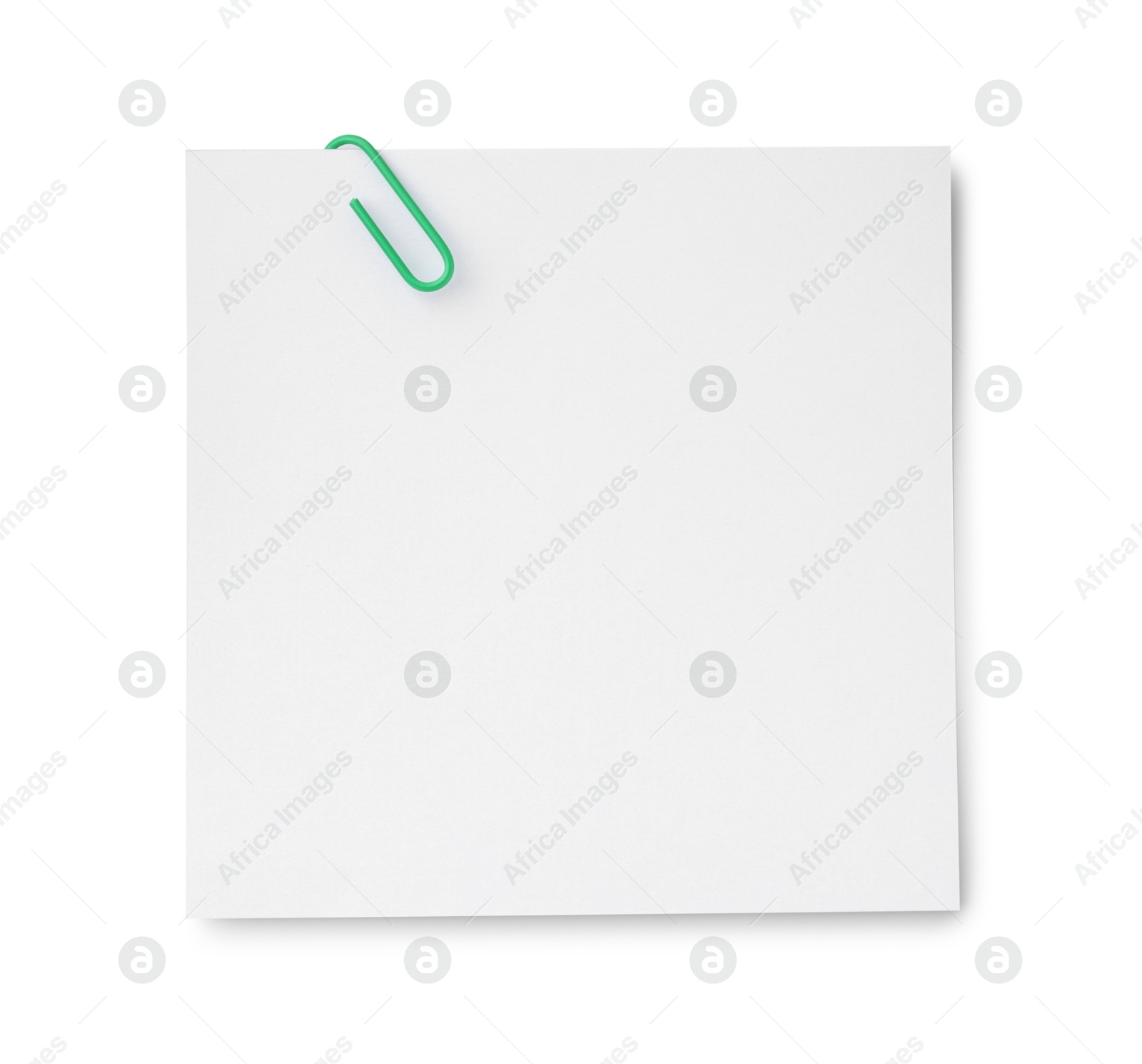 Photo of Blank paper note attached with clip isolated on white, top view