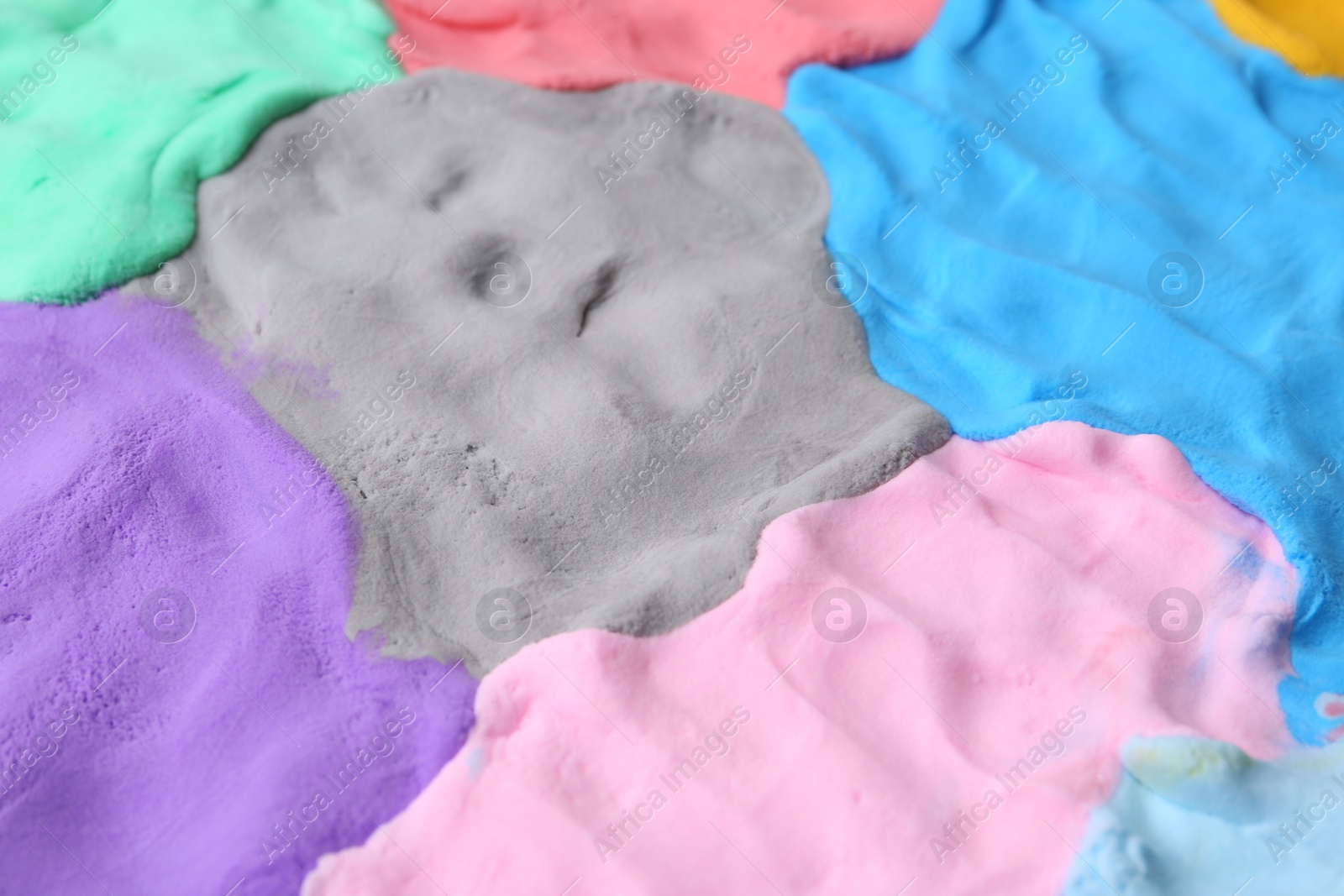 Photo of Different colorful play dough as background, closeup