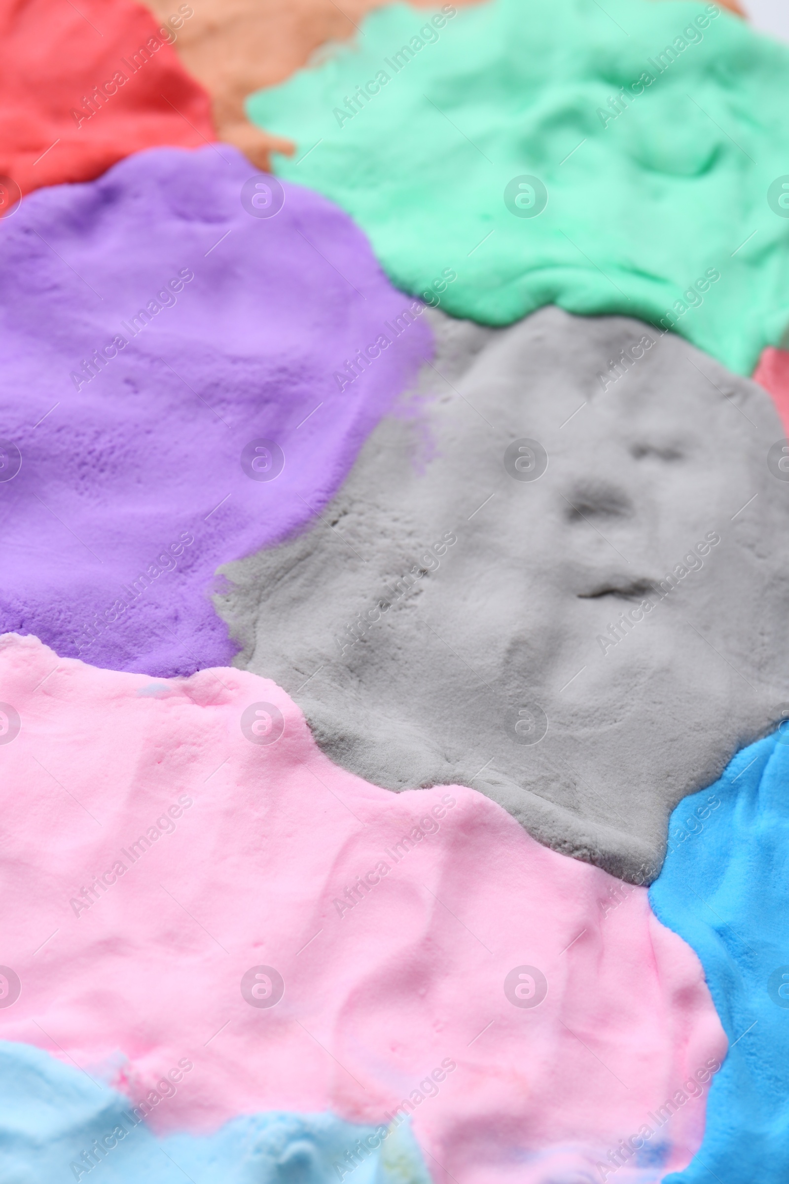 Photo of Different colorful play dough as background, closeup