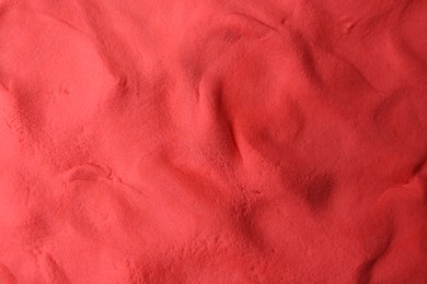 Photo of Red play dough as background, top view