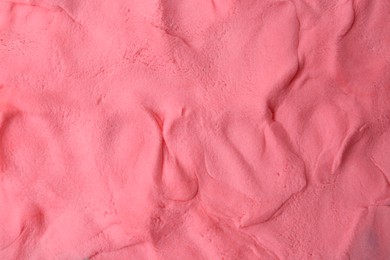 Photo of Pink play dough as background, top view