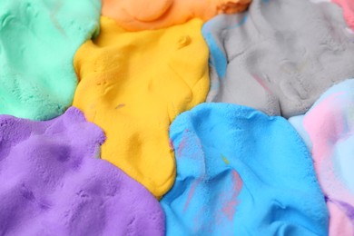 Photo of Different colorful play dough as background, closeup