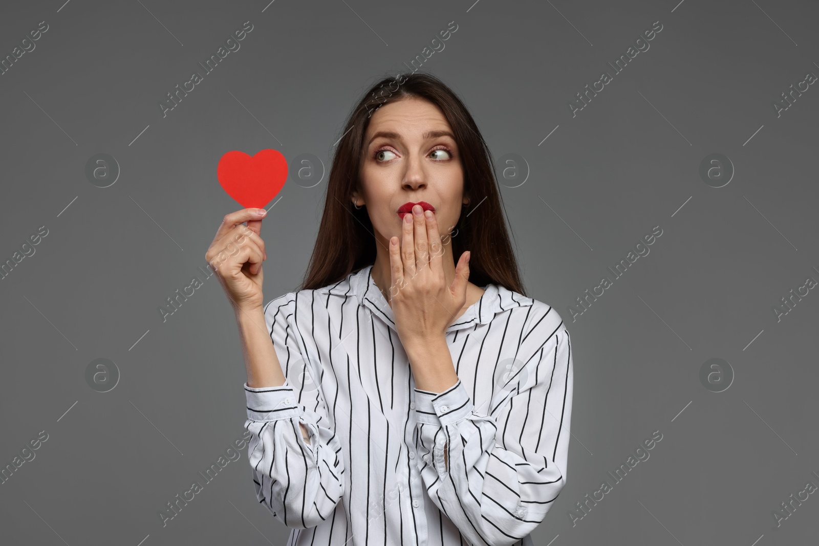 Photo of Happy Valentine's Day. Beautiful woman with paper heart on grey background