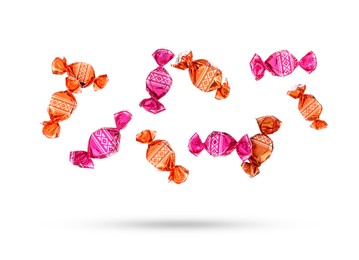 Image of Candies in bright wrappers falling on white background