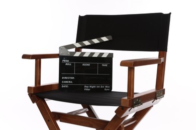 Photo of Director's chair with clapperboard isolated on white