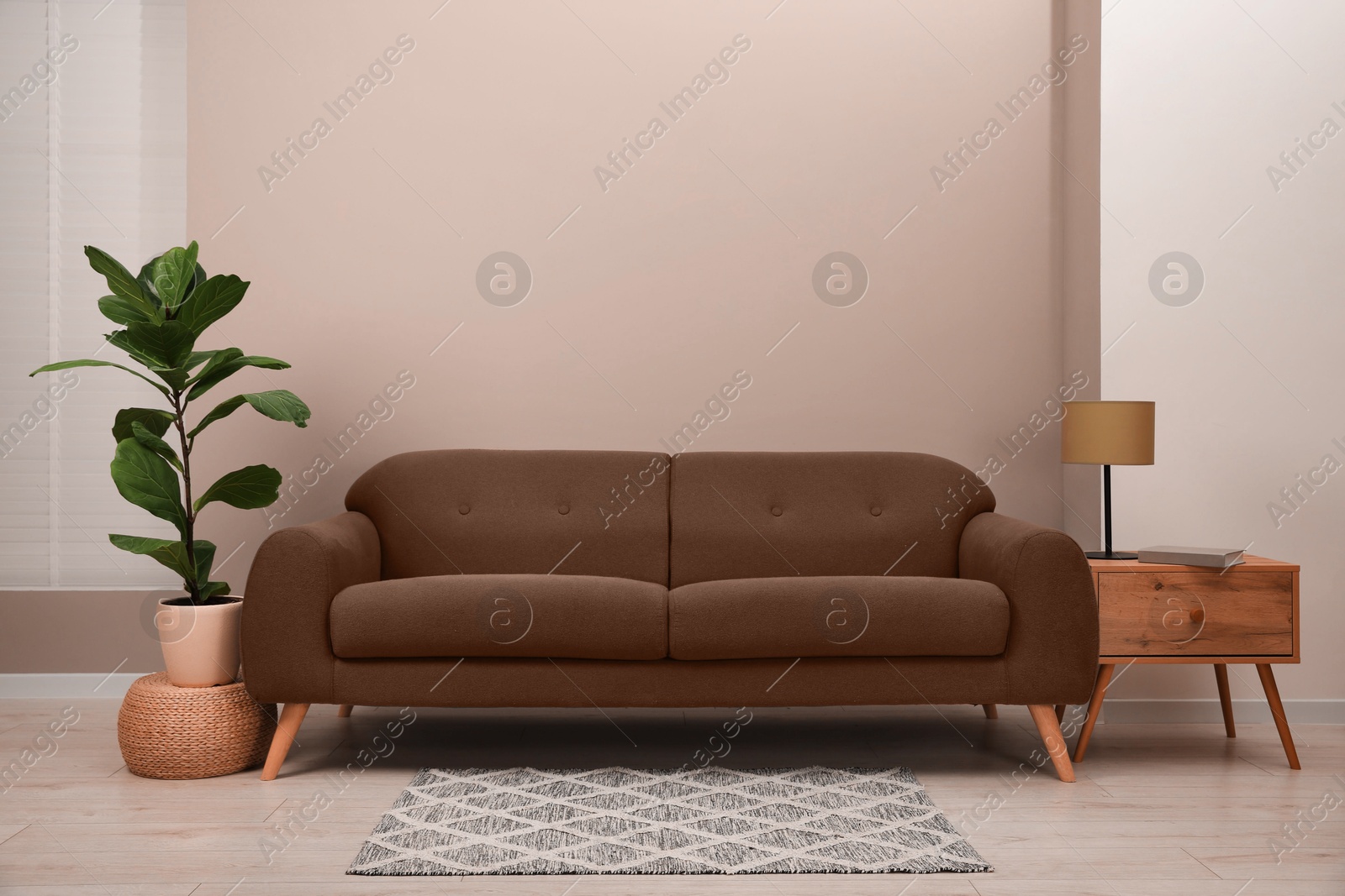 Image of Sofa in mocha mousse shade indoors. Interior with trendy color of 2025 year