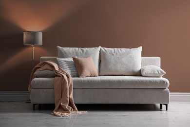 Image of Stylish interior in mocha mousse shade. Decor and wall in trendy color of 2025 year