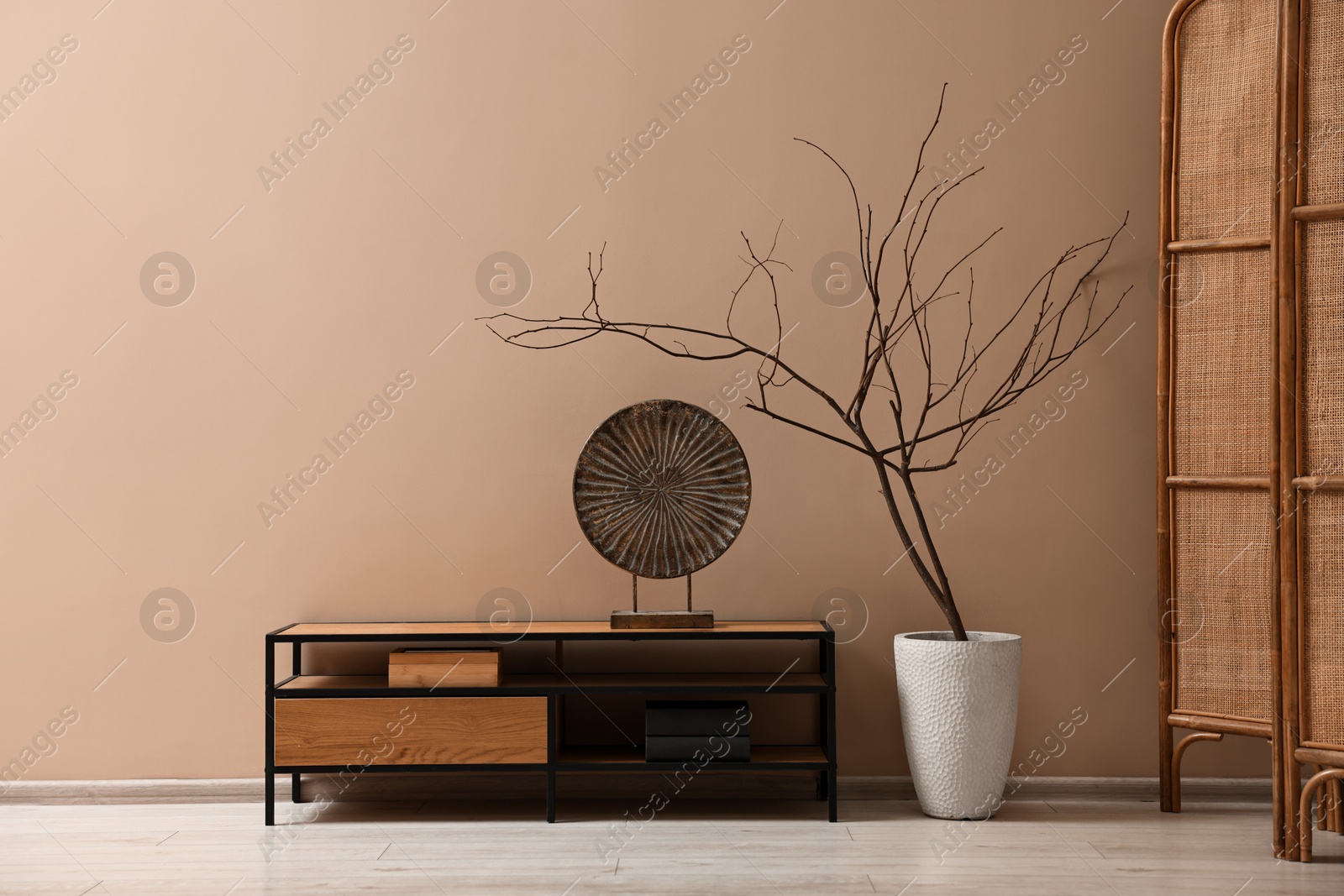 Image of Stylish interior in mocha mousse shade. Table and wall in trendy color of 2025 year