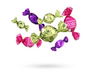 Image of Candies in bright wrappers falling on white background