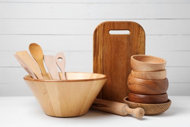 Photo of Dishware and cooking utensils on white table