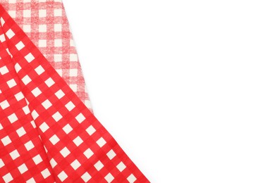 Photo of Red checkered tablecloth isolated on white, top view