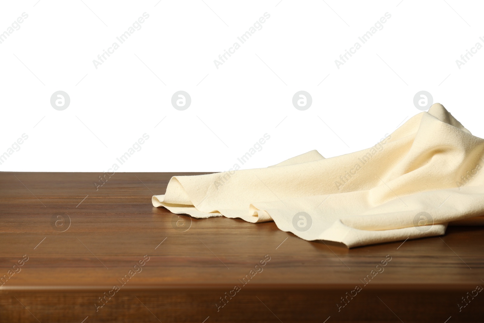 Photo of Beige tablecloth on wooden table against white background