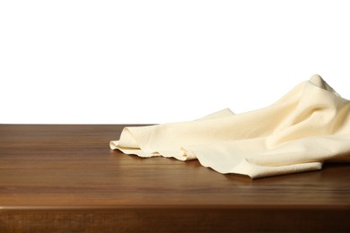 Photo of Beige tablecloth on wooden table against white background