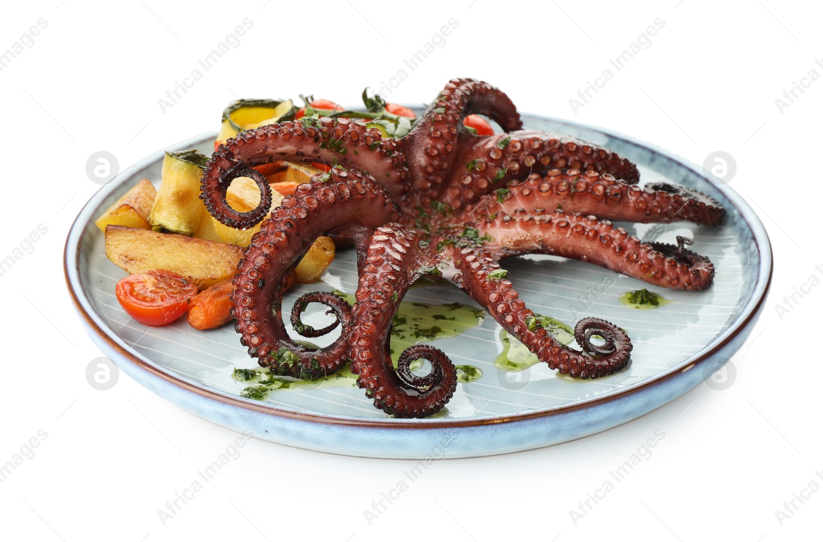 Photo of Fried octopus with herb sauce and vegetables isolated on white