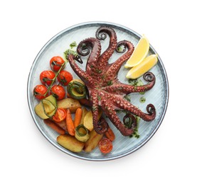 Photo of Fried octopus with herb sauce, lemon and vegetables isolated on white, top view