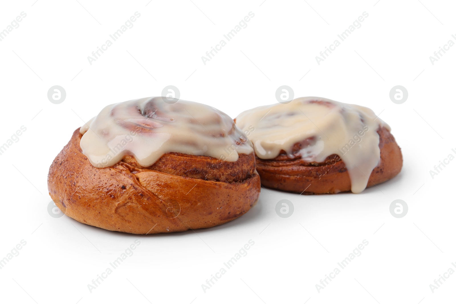 Photo of Tasty cinnamon rolls with cream isolated on white