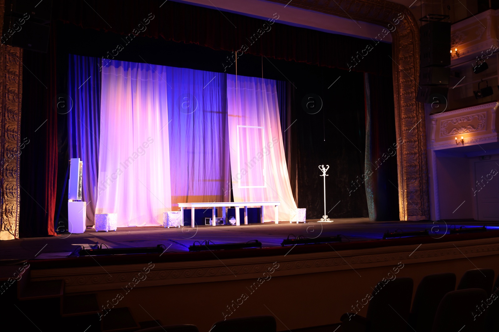 Photo of Different furniture and other decorations on stage in theatre