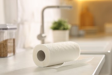 Photo of Roll of paper towels on white countertop in kitchen