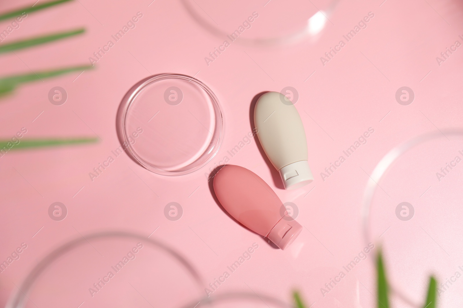 Photo of Stylish presentation of cosmetic products on pink background, flat lay