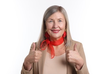 Photo of Senior woman showing thumbs up on white background