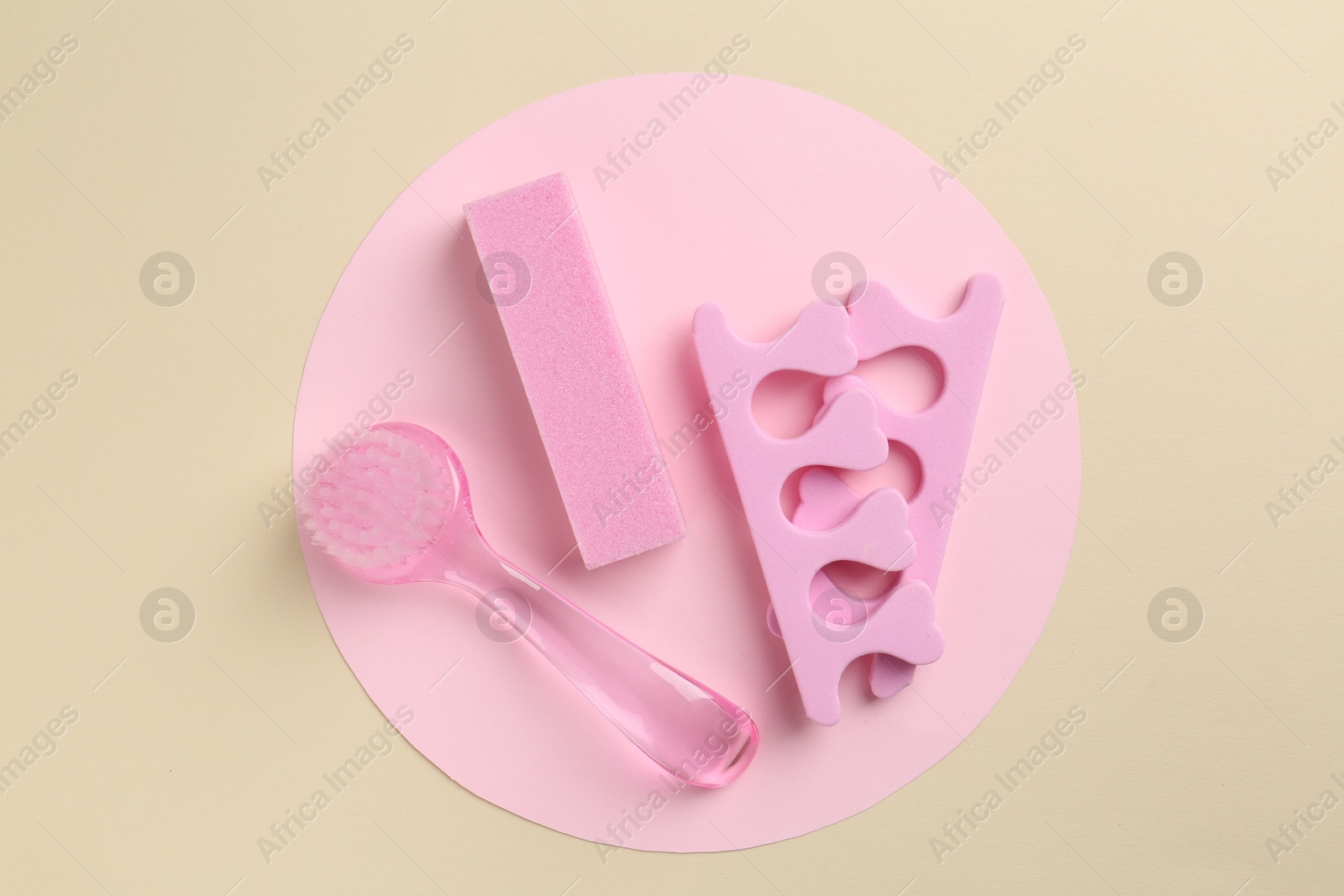 Photo of Set of pedicure tools on color background, flat lay