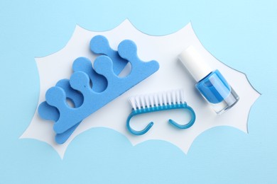 Photo of Set of pedicure tools on color background, flat lay