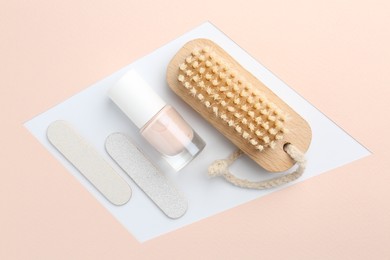 Photo of Pedicure procedure. Nail polish, files and brush on color background, flat lay