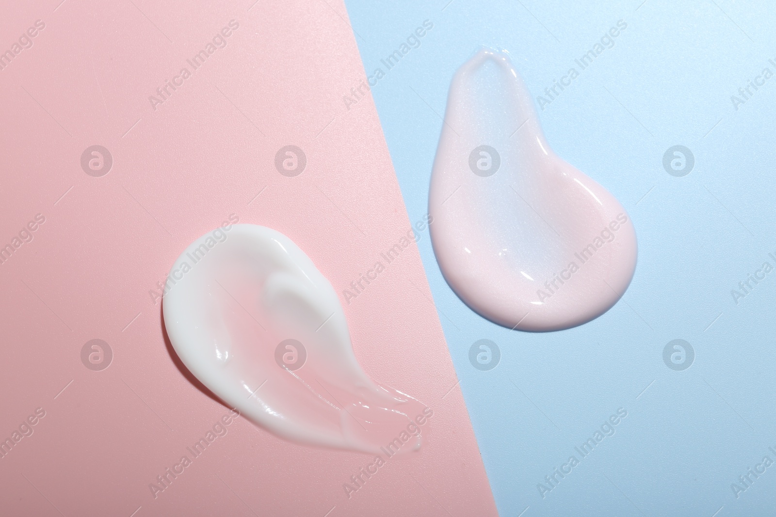 Photo of Cream samples on color background, top view