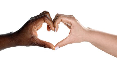 Photo of Stop racism. People of different skin colors making heart with hands on white background, closeup