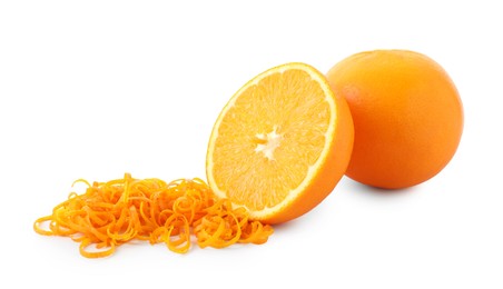 Photo of Pile of fresh orange zest, whole and cut fruit isolated on white