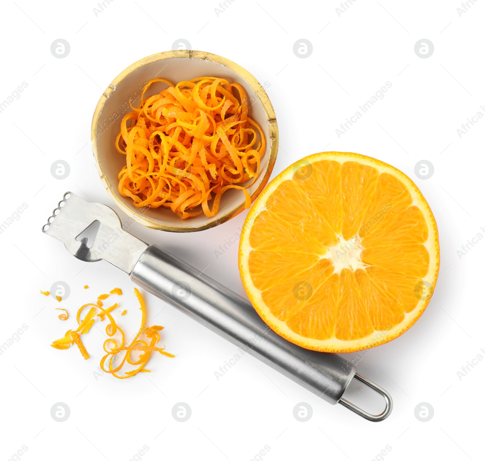 Photo of Fresh orange zest in bowl, cut fruit and zester isolated on white, top view