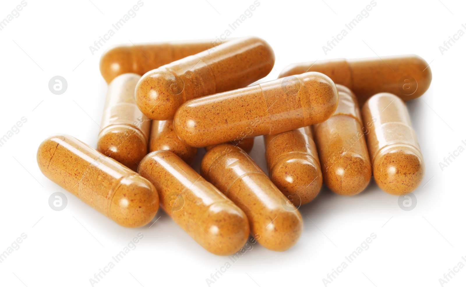 Photo of Many turmeric capsules isolated on white. Herbal dietary supplement