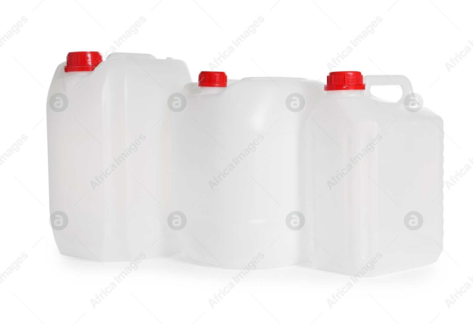 Photo of Three plastic canisters with caps isolated on white