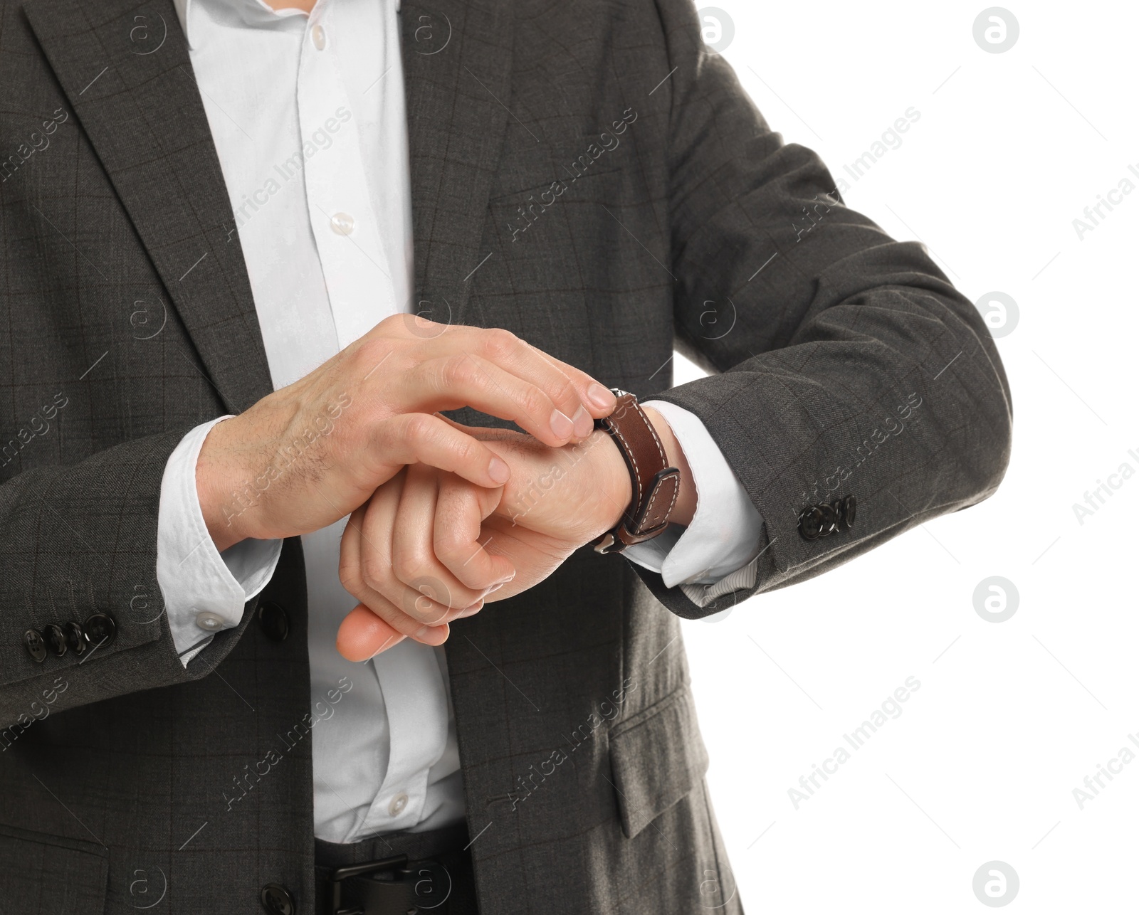 Photo of Man in classic suit checking time on white background, closeup