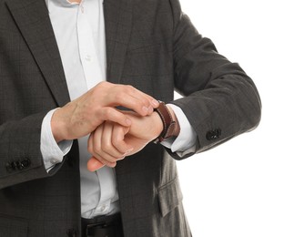 Photo of Man in classic suit checking time on white background, closeup