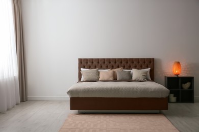 Image of Cozy bedroom interior with mocha mousse shade. Trendy color of 2025 year