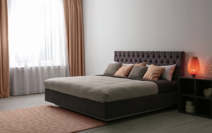 Image of Cozy bedroom interior with mocha mousse shade. Trendy color of 2025 year