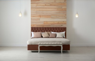 Image of Bed in mocha mousse shade indoors. Cozy bedroom interior. Trendy color of 2025 year