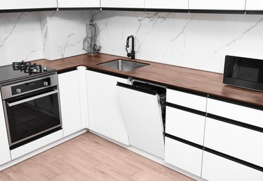 Image of Countertop in mocha mousse shade in kitchen. Cozy interior with color of 2025 year