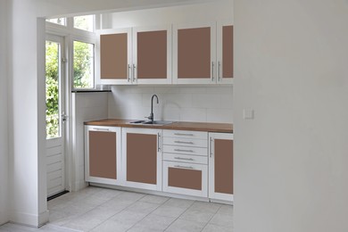 Image of Stylish kitchen interior with mocha mousse shade. Trendy color of 2025 year