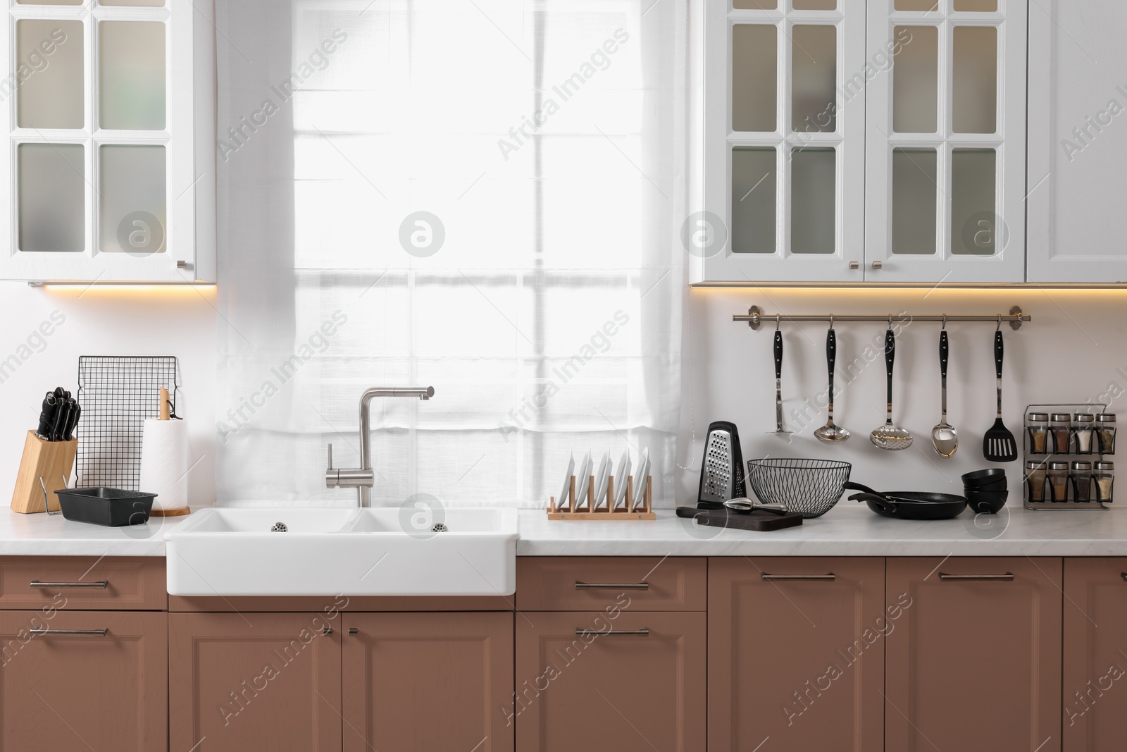 Image of Stylish kitchen interior with mocha mousse shade. Trendy color of 2025 year