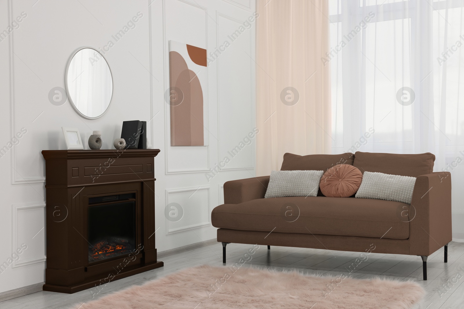 Image of Stylish living room interior in mocha mousse shade. Sofa and fireplace brown tone. Trendy color of 2025 year