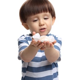 Photo of Cute little child with tasty mochi on white background