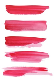 Photo of Pink watercolor strokes on white background, top view