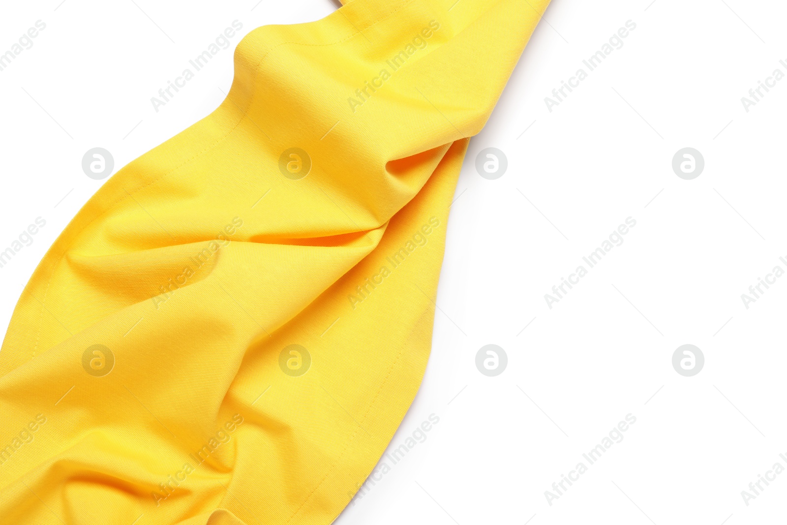 Photo of Yellow tablecloth isolated on white, top view