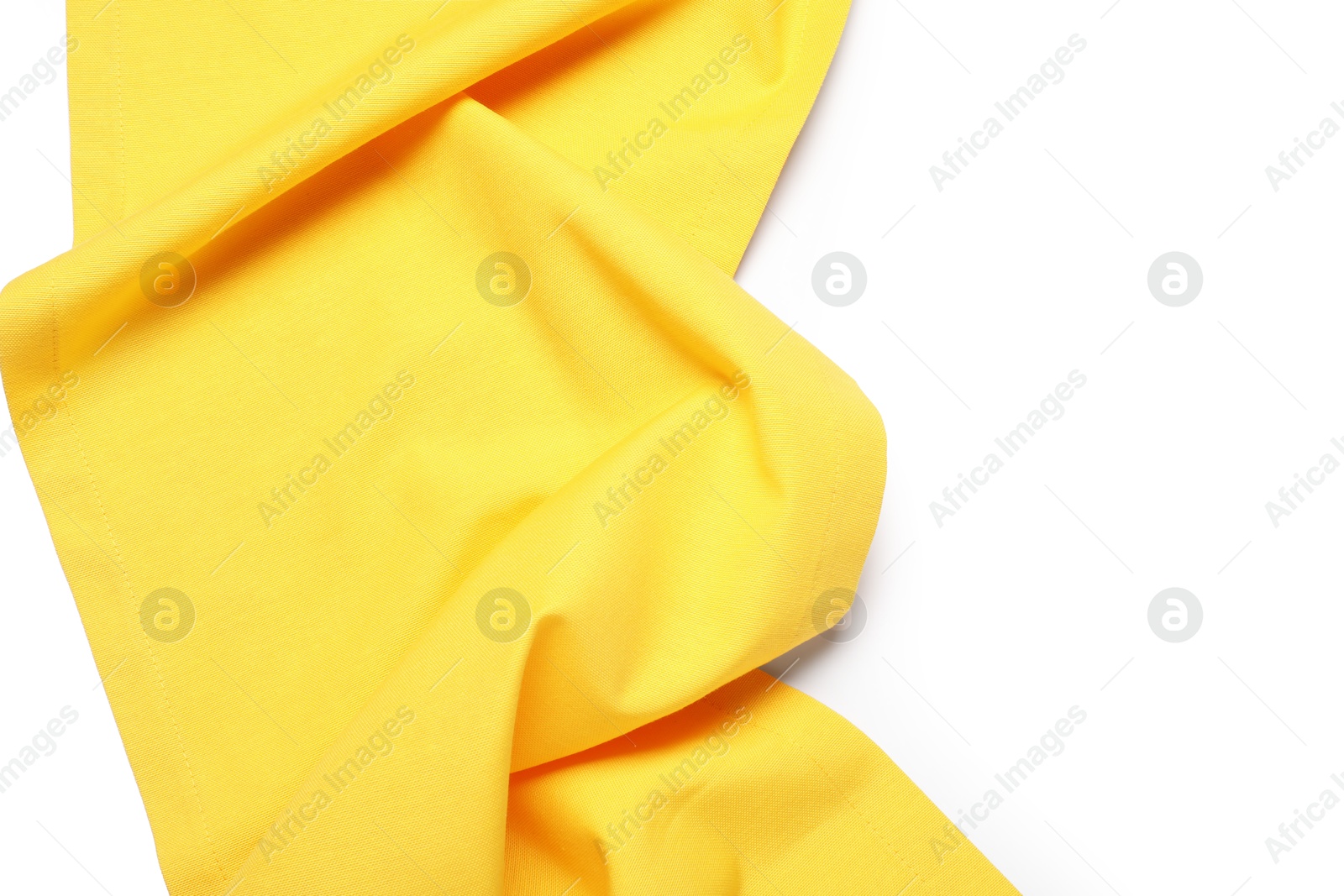 Photo of Yellow tablecloth isolated on white, top view