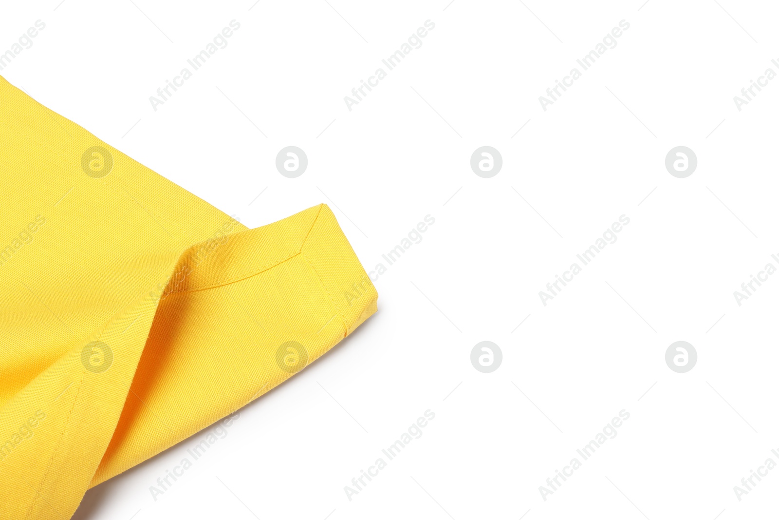 Photo of Yellow tablecloth isolated on white, top view