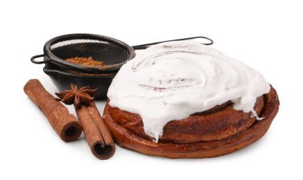 Photo of Tasty cinnamon roll with cream and spices isolated on white