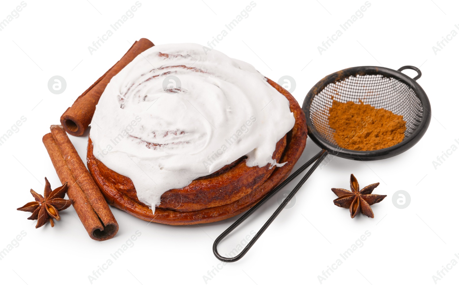 Photo of Tasty cinnamon roll with cream and spices isolated on white